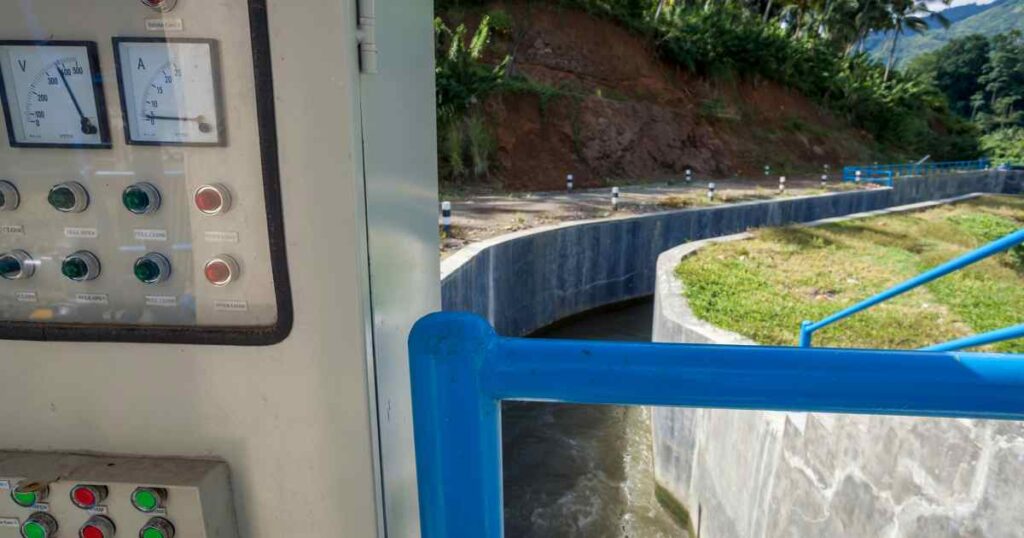 municipal wastewater treatment plant aerial view showing secondary clarifiers and aeration tanks