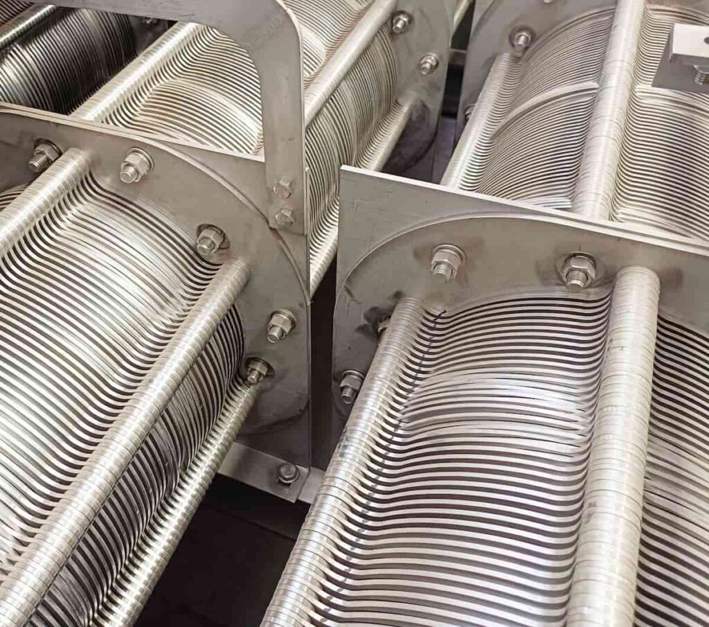 Detail showing the internal zones of a multi-disk screw press dewatering machine including gravity thickening and compression zones